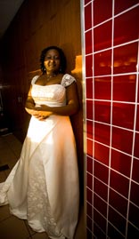 Gorgeous: Bride against red tiled background
