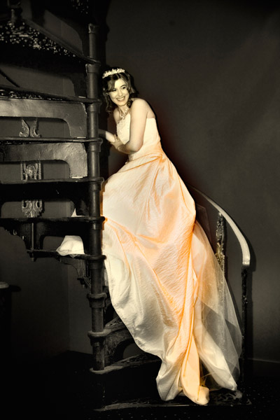 Monochrome-duplex image Donna on spiral staircase inside Chevin Lodge Hotel