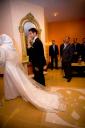 Arabic bride and groom walking past the guests at the wedding reception