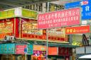 zillions of colourful Chinese characters announce Hong Kong to me
