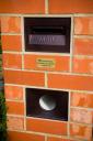 Australian mailbox built into brick wall - smart and orderly