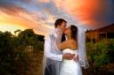 sunset wedding kiss amongst Kaesler Wines grapevines in Australia