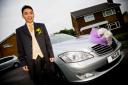 Chinese Bridegroom by the wedding car in Leeds