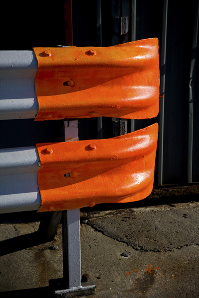 orange tips to these crash barriers are magnificent in the evening sunlight at Killybegs. A tiny splash of orange paint also marks the ground below!