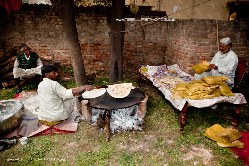 Preparing chapatis for an Asian wedding in Pakistan