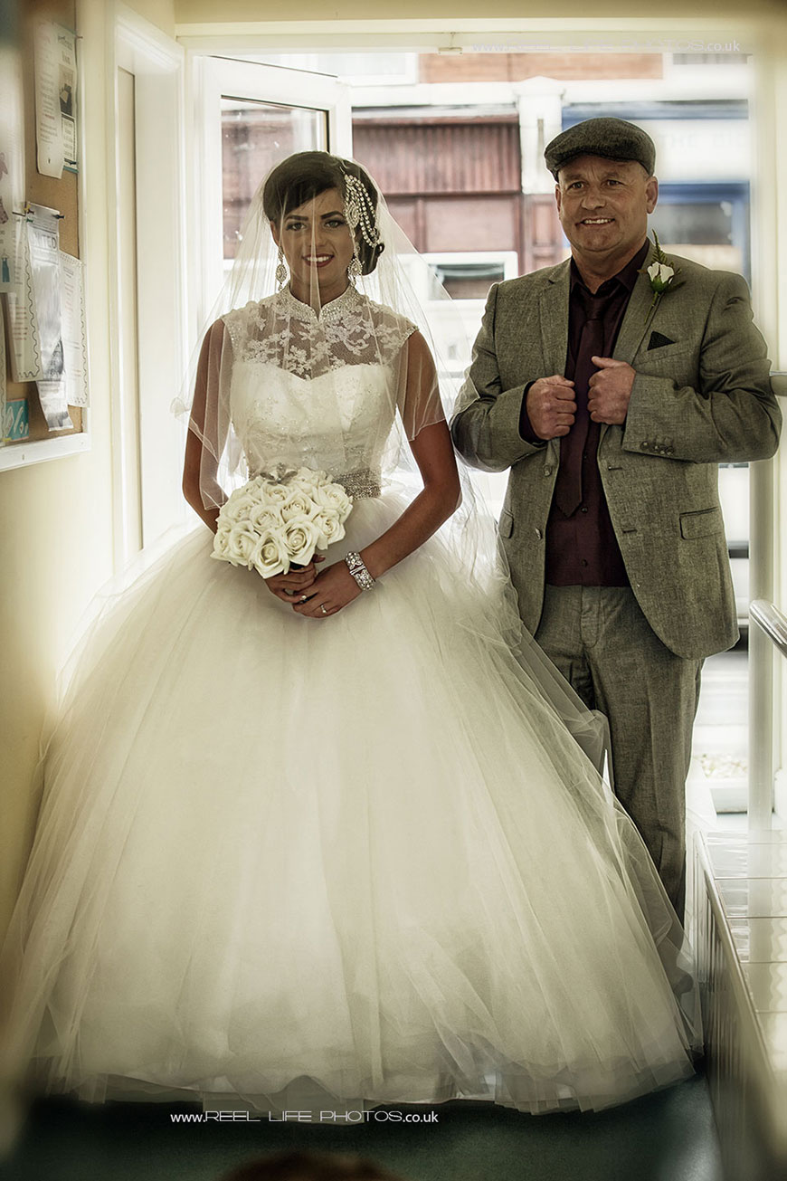 gipsy wedding picture of bride with her father at church in West Yorkshire