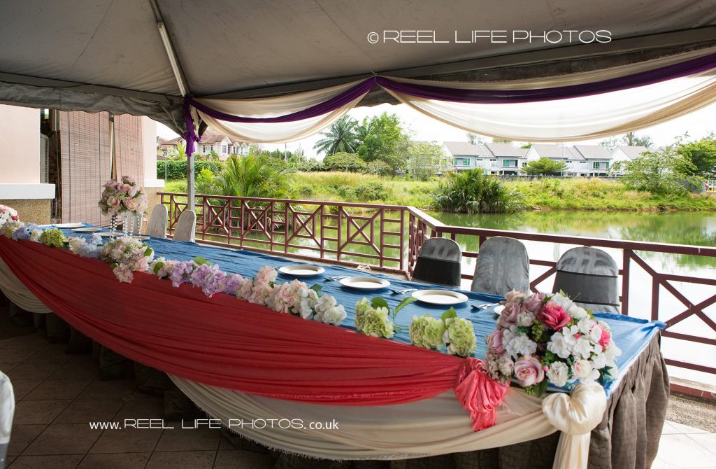 Wedding food on top table at the wedding reception at Kelab Bandar Laguna Merbok in Sungai Petani, Malaysia,